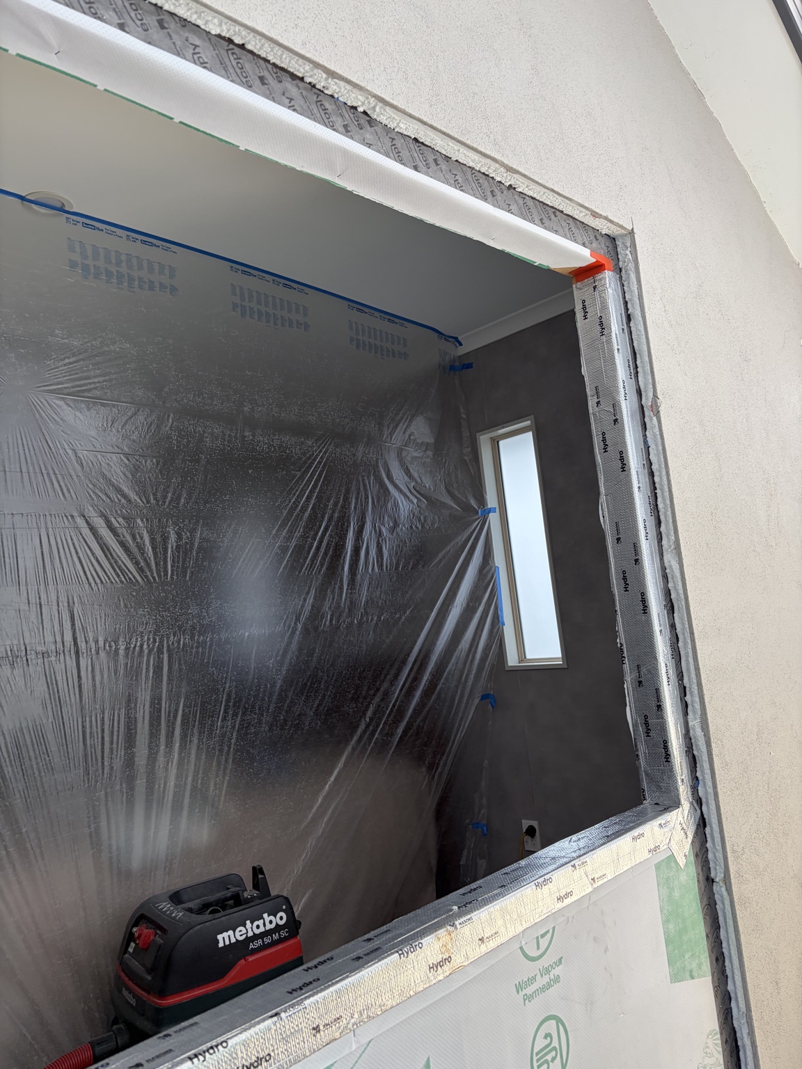 Building wrap and flashing preparation around the new window opening