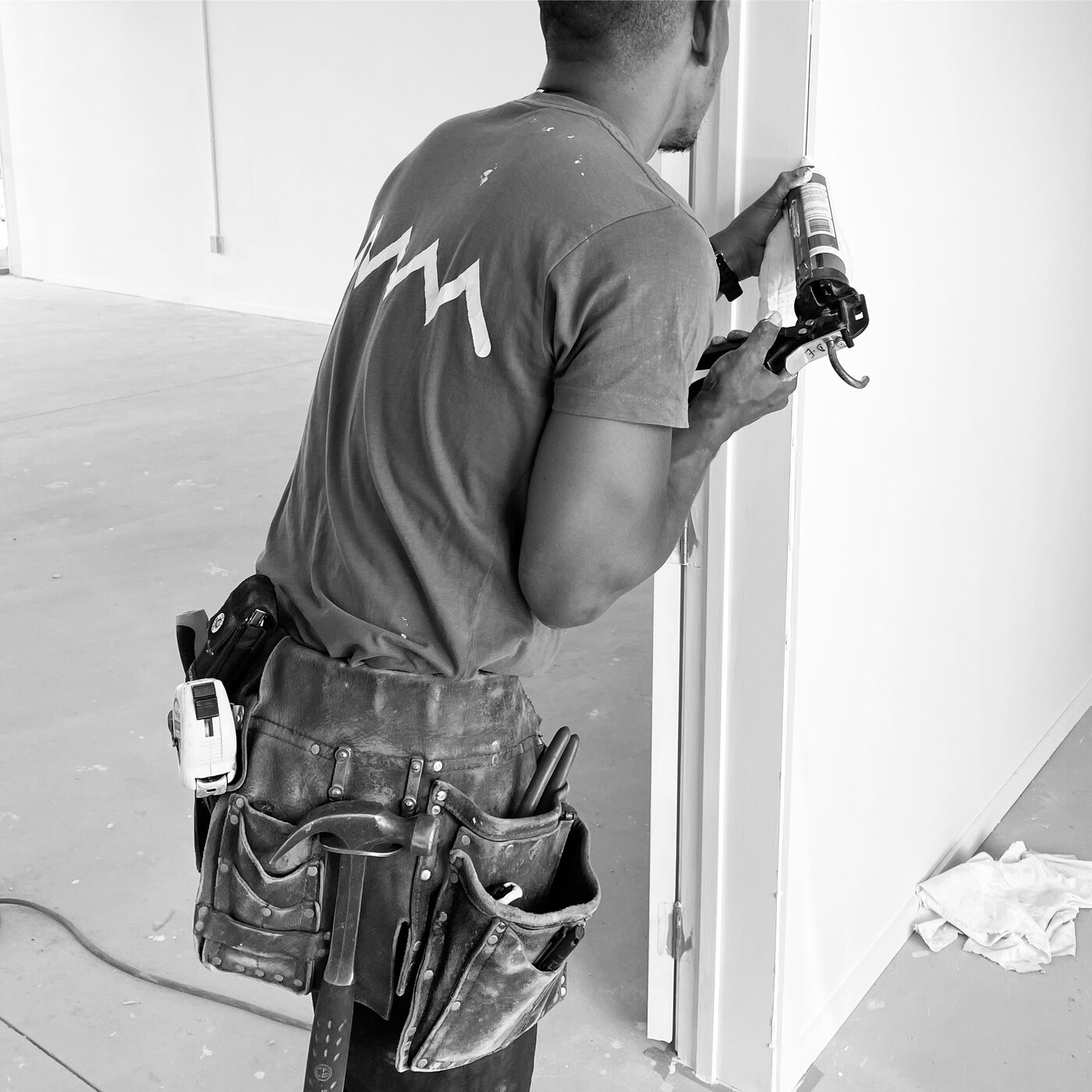 GRIT carpenter in uniform completing detailed finishing work