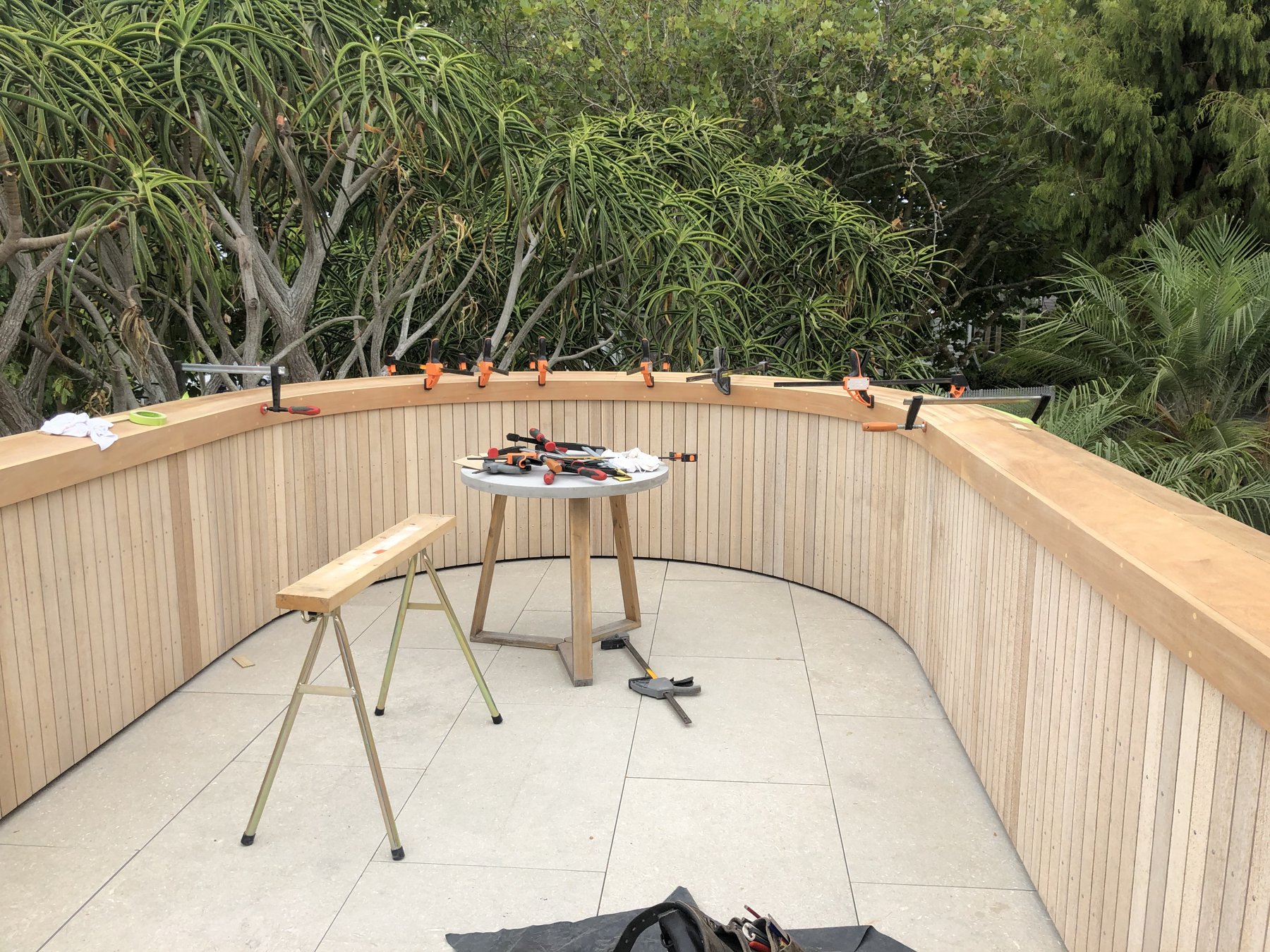 Curved timber capping detail during construction at the Herne Bay project